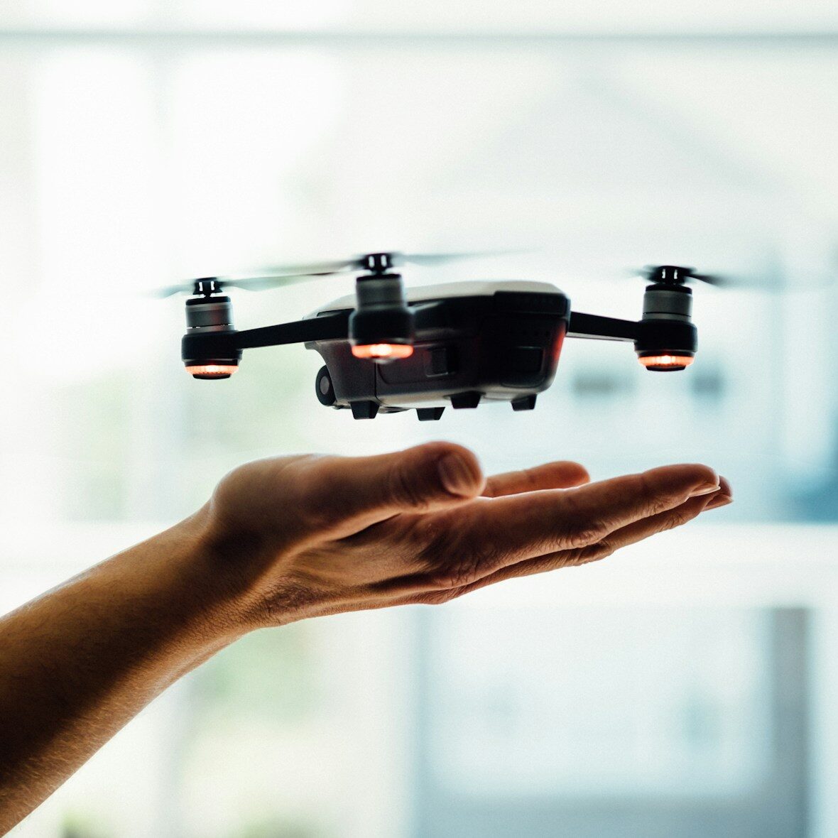 turned on black quadcopter drone